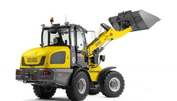 Compact wheel loader for versatile material handling, ideal for small-scale construction, urban work, and tight spaces.