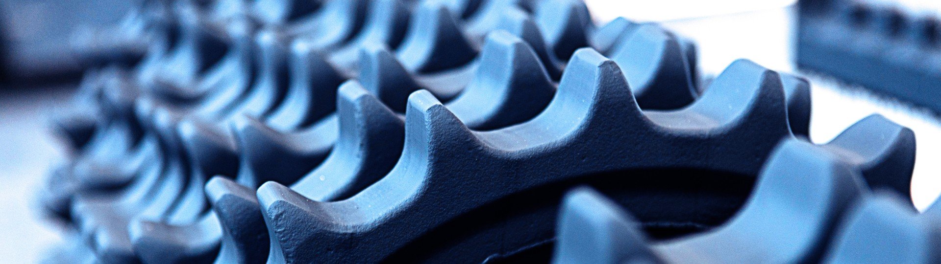 Sprockets and segments made from high-quality materials, precision-machined and heat-treated for severe-duty applications across various heavy equipment models.