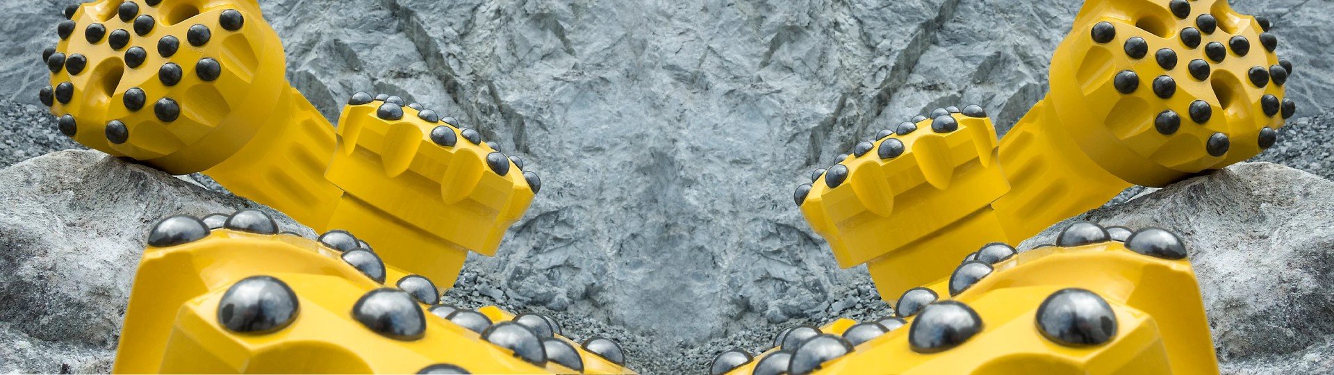 High-performance DTH drilling tools designed for efficient rock drilling, featuring a percussive hammer directly behind the bit to break hard rock into small particles.