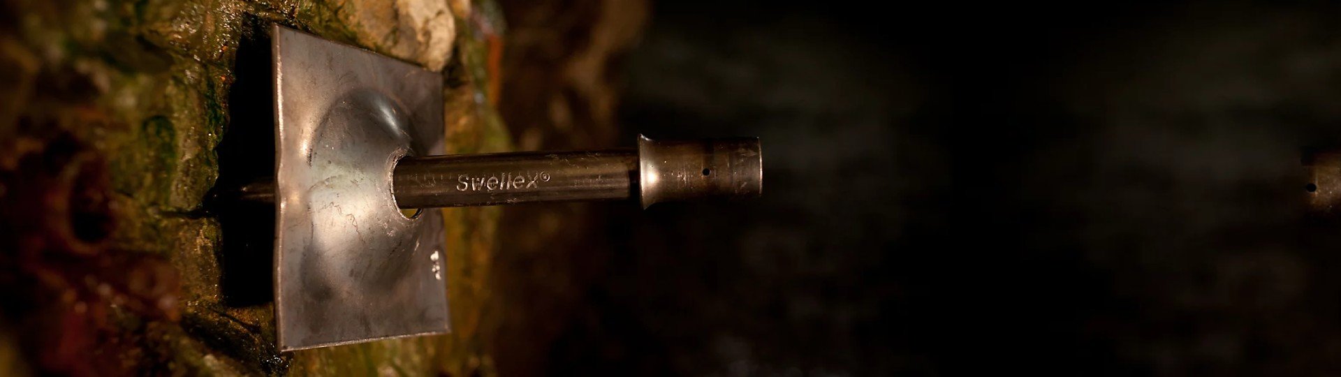 Epiroc’s Swellex expandable rock bolting system, using high-pressure water to expand the welded tube inside the borehole, stabilizing excavated rock mass in mines and tunnels.