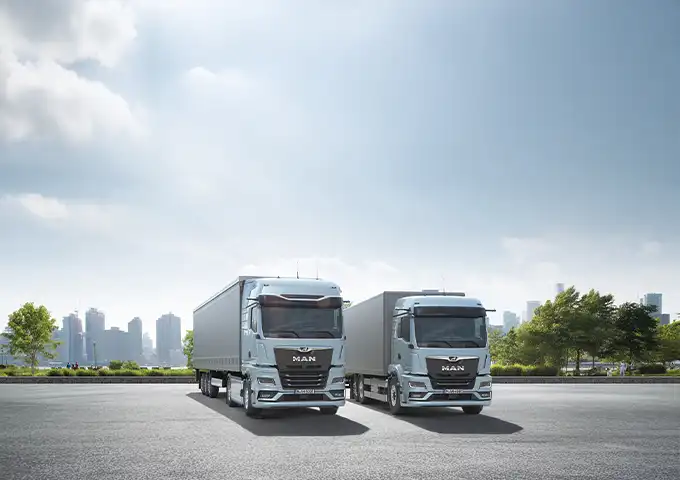 MAN TGS/TGX series trucks with trailers for efficient distribution and road transport in the UAE. Fuel-efficient logistics solutions by UMHE.